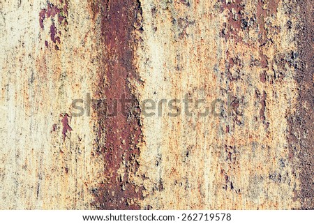 Old yellow grunge metal wall with red rust, background photo texture with vintage toned photo filter effect, instagram style