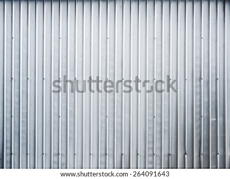 Shining ridged garage metal wall, background photo texture