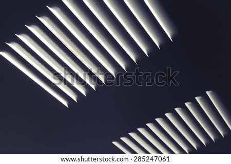 Dark metal industrial wall with ventilation grille, closeup photo with selective focus and shallow DOF