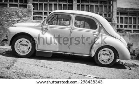 Ajaccio, France - July 6, 2015: White Renault 4CV old-timer economy car stands parked on a roadside in French town, side view