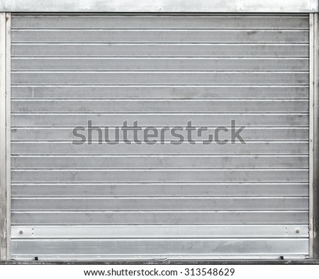Gray metal garage gate with rolling shutters, background texture