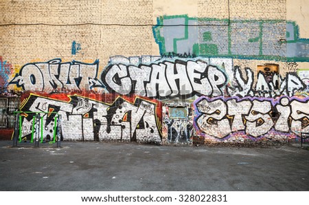 Saint-Petersburg, Russia - May 6, 2015: Street art, urban wall with graffiti text patterns. Front view. Vasilievsky island, Central old part of St. Petersburg city