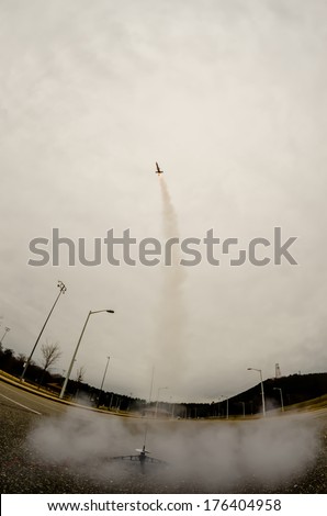 model rocket launch in parking lot