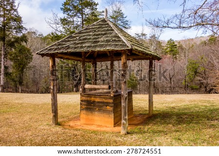 old historic water well in the forest