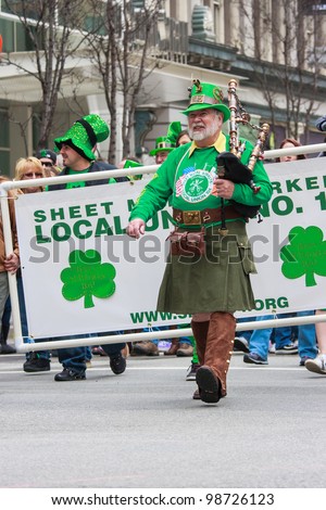 SAN FRANCISCO, CA - MARCH 17: A man dressed in traditional Irish clothes plays uilleann pipes - an Irish musical instrument during the St. Patric\'s Day Parade, March 17, 2012 in San Francisco, CA