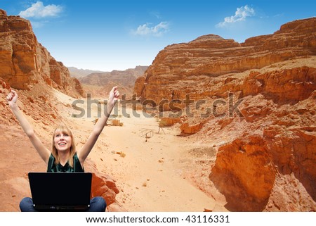 Girl with a laptop in the mountains sent the message