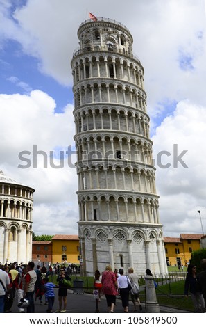 PISA, ITALY - JUNE 11: crowd of tourists on the Unesco World Heritage site Piazza dei Miracoli with Leaning Tower on June 11, 2012 in Pisa, Italy