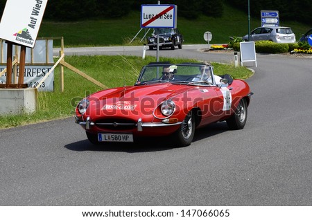 LUNZ, AUSTRIA - JULY 19: Jaguar E-Type on special stage by International Ennstal Classic 2013, a yearly tournament through Austria for vintage cars on July 19, 2013, in Lunz am See, Austria
