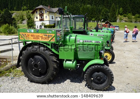 LUNZ, AUSTRIA - JULY 19: Exhibition of different vintage tractors in connection to international Ennstal Classic 2013 for vintage vehicles and cars, on July 19, 2013, in Lunz am See, Austria