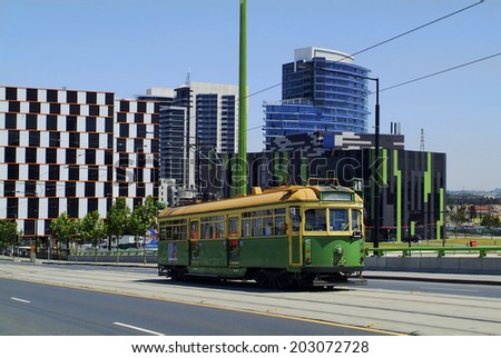 MELBOURNE, AUSTRALIA - NOVEMBER 09: Public tram and modern office buildings on Victoria harbor in the capital city of Victoria, on November 09, 2006 in Melbourne, Australia