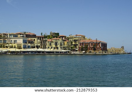 CHANIA, GREECE - MAY 27: Unidentified people and different restaurants and hotels on the harbor of the medieval village in Crete, on May 27, 2014 in Chania, Greece