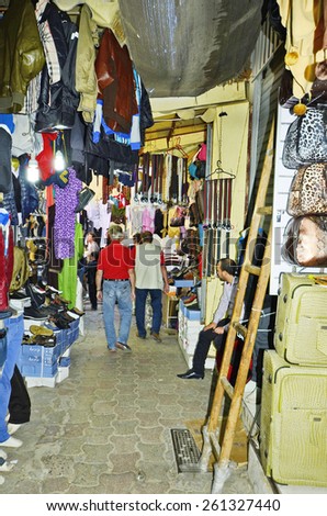 MEKNES, MOROCCO - NOVEMBER 19: Unidentified people in the carpet souk with different shops, a kind of shopping mall on November 19, 2014 in Meknes, Morocco