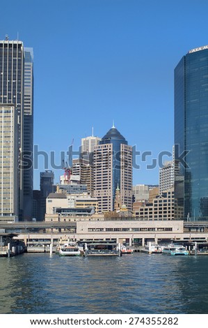 SYDNEY, AUSTRALIA - MAY 10: Circular quay, the transportation hub for ship, bus and train, skyline with different buildings and old church behind, on May 10, 2010 in Sydney, Australia
