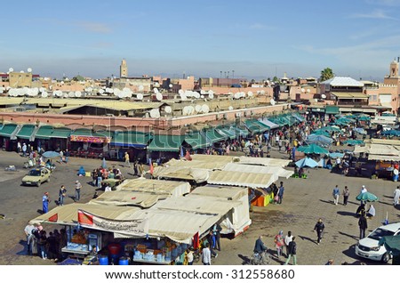 MARRAKESH, MOROCCO - NOVEMBER 23: Unidentified people, kiosks, shops and market stalls on Djemaa el-Fna square, a Unesco world heritage site, on November 23, 2014 in Marrakesh, Morocco