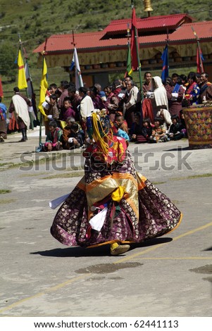 HAA, BHUTAN - SEPTEMBER 21: unknown spectators and dancers by religious festival named Tshechu in Haa, Western Bhutan, in the White Temple on September 21, 2007 in Haa Village in Bhutan
