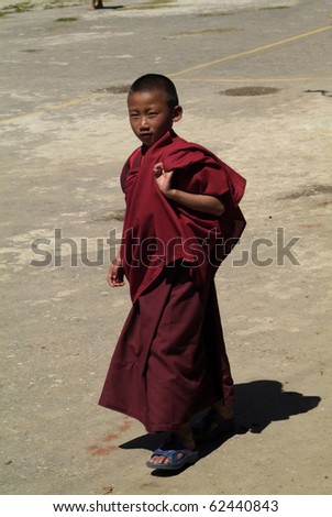 HAA, BHUTAN - SEPTEMBER 21: unidentified young monk by religious festival named Tshechu in Haa, Western Bhutan, in the White Temple -Karpho Lhakhang- on September 21, 2007 in Haa Village in Bhutan