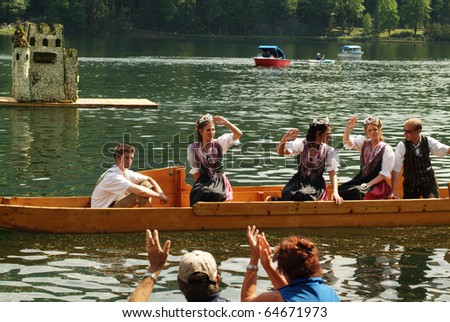 BAD AUSSEE, AUSTRIA - MAY 30: unidentified actors and spectators at Narcissus Festival on Grundlsee-Lake on May 30, 2005 in Bad Aussee in Styria, Austria