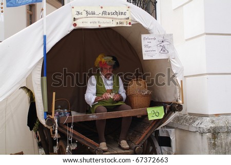 NEUBURG, GERMANY - JULY 3: unidentiefied working actor sell handcraft tools by ancient city festival on July 03, 2005 in Neuburg on Danube, Bavaria, Germany