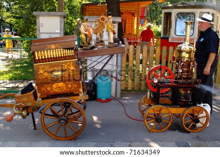 VIENNA, AUSTRIA - SEPTEMBER 02: unidentified man with his steam working barrel organ in the yearly meeting for organ grinders in the Bohemian Prater on September 02, 2006 in Vienna, Austria