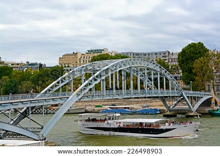 PARIS - August 17, 2014: Passerelle Debilly - foot bridge in Paris. Bridge was built as the Eiffel Tower, for the World Expo, only in 1900, was conceived as a temporary structure, and stayed forever.