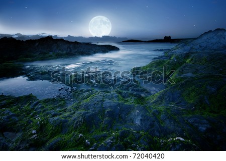 Full moon over the coast in Cornwall, UK