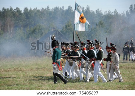 IGANIE, POLAND - APRIL 16: Members of Belorussian Infantry Regiment march to attack at Battle of Iganie (1831) reenacted on a battlefield on 180th anniversary on April 16, 2011 in Iganie, Poland