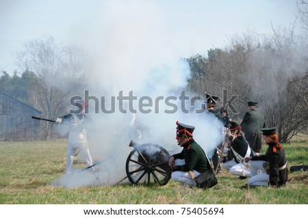 IGANIE, POLAND - APRIL 16: Members of Historic Artillery Group fire a cannon at Battle of Iganie (1831) reenacted on a battlefield on 180th anniversary on April 16, 2011 in Iganie, Poland
