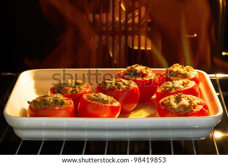 Delicious baked stuffed tomatoes with meat and vegetables in the oven