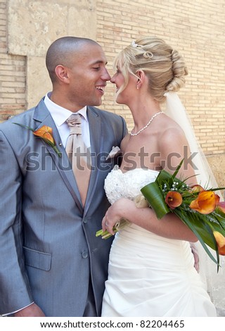 Bride and Groom enjoying a moment together outside the church