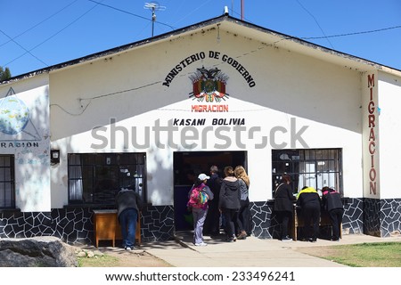 KASANI, BOLIVIA - OCTOBER 10, 2014: Unidentified people standing in line in front of the migration office on the Bolivian side of the Peruvian-Bolivian border on October 10, 2014 in Kasani, Bolivia