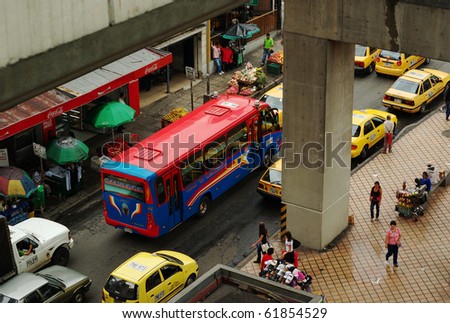 MEDELLIN, COLOMBIA - JANUARY 23: Typical street with buses and taxis on January 23, 2010 in downtown Medellin, Colombia. Buses, taxis are the most common public transportation form in South America.