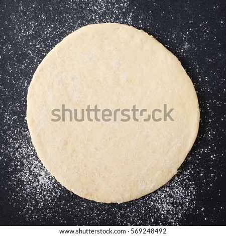 Similar – Image, Stock Photo Dough rolled out on a green background. Homemade pie crust and rolling pin. Baking concept