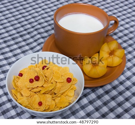 Healthy breakfast cereal . Corn flakes and fruits. quick and tasty