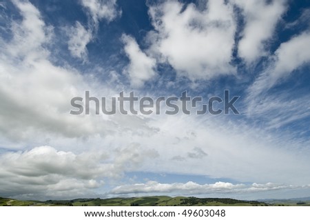 big sky shot with wide angle lens, rolling green hills at the bottom, northern California, Sonoma Valley