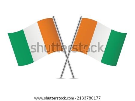 Ivory Coast crossed flags. Ivorian flags, isolated on white background. Vector icon set. Vector illustration.