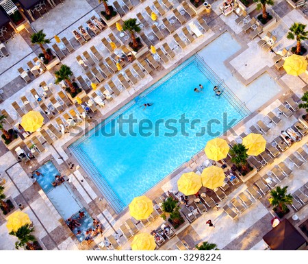 Bird\'s eye view of a swimming pool at a 5 star hotel.