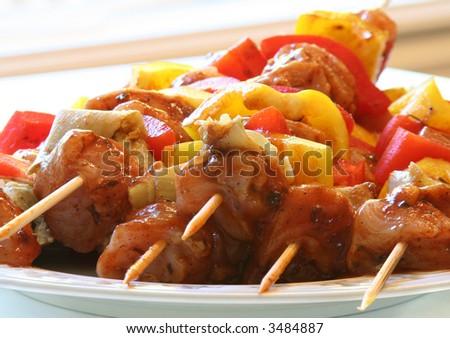 Marinated chicken and vegetable kabobs.