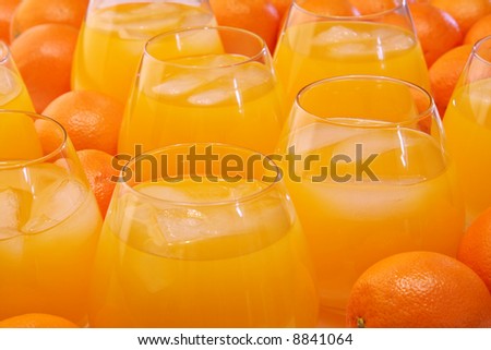 Background of oranges and glasses of orange juice.