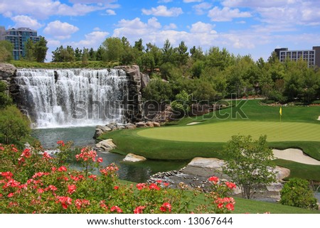 Beautiful golf course and waterfall.