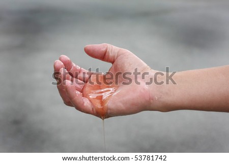 Man\'s hands covered in oil. Oil spill concept.