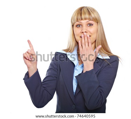 Portrait of a happy surprised business woman pointing at something and cover her mouth over white background