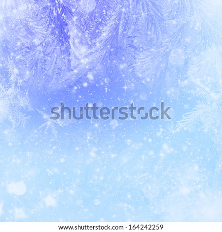 Blue Christmas background with stars, frost and bokeh