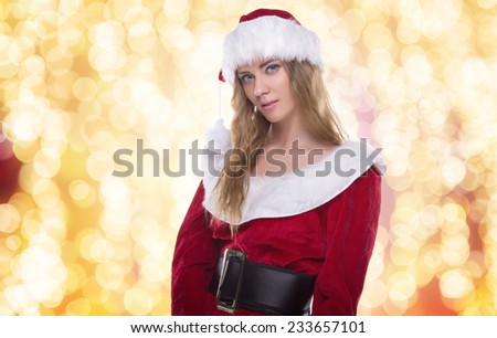 Beautiful young girl in a Christmas costume. New Year's holidays. Woman celebrating Christmas
