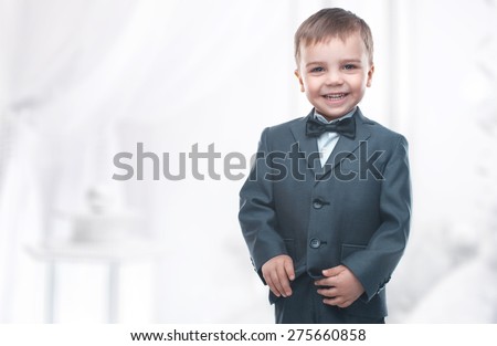 Little boy in a nice suit and glasses. Back to school. Children portrait. Stylish man in fashionable suit