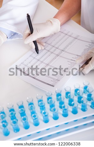 Two lab technicians at work in a laboratory