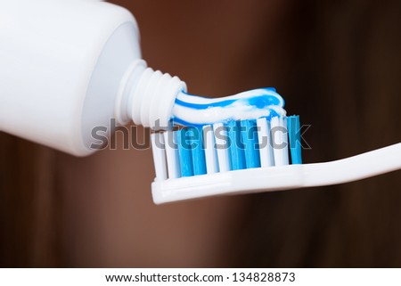 Close Up On Adding Toothpaste On Brush