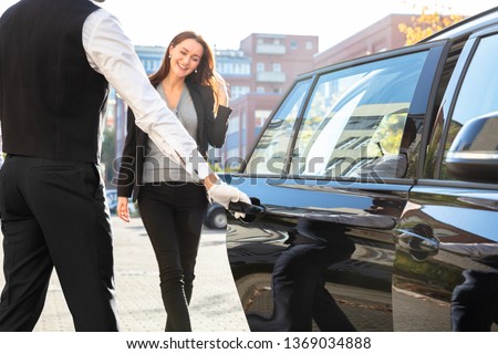Chauffeur Opening Private Car Door For Businesswoman ストックフォト © 