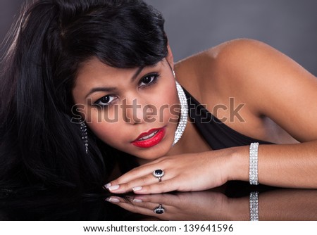 Young Beautiful Woman Wearing Diamond Jewelry Over Black Background