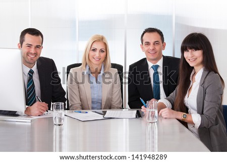 Happy Business Team In Office At The Meeting