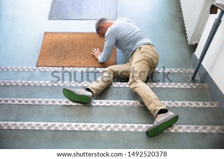 Mature Man Lying On Staircase After Slip And Fall Accident Сток-фото © 